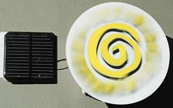 Solar panel directly powering a dc electric motor with a spinner